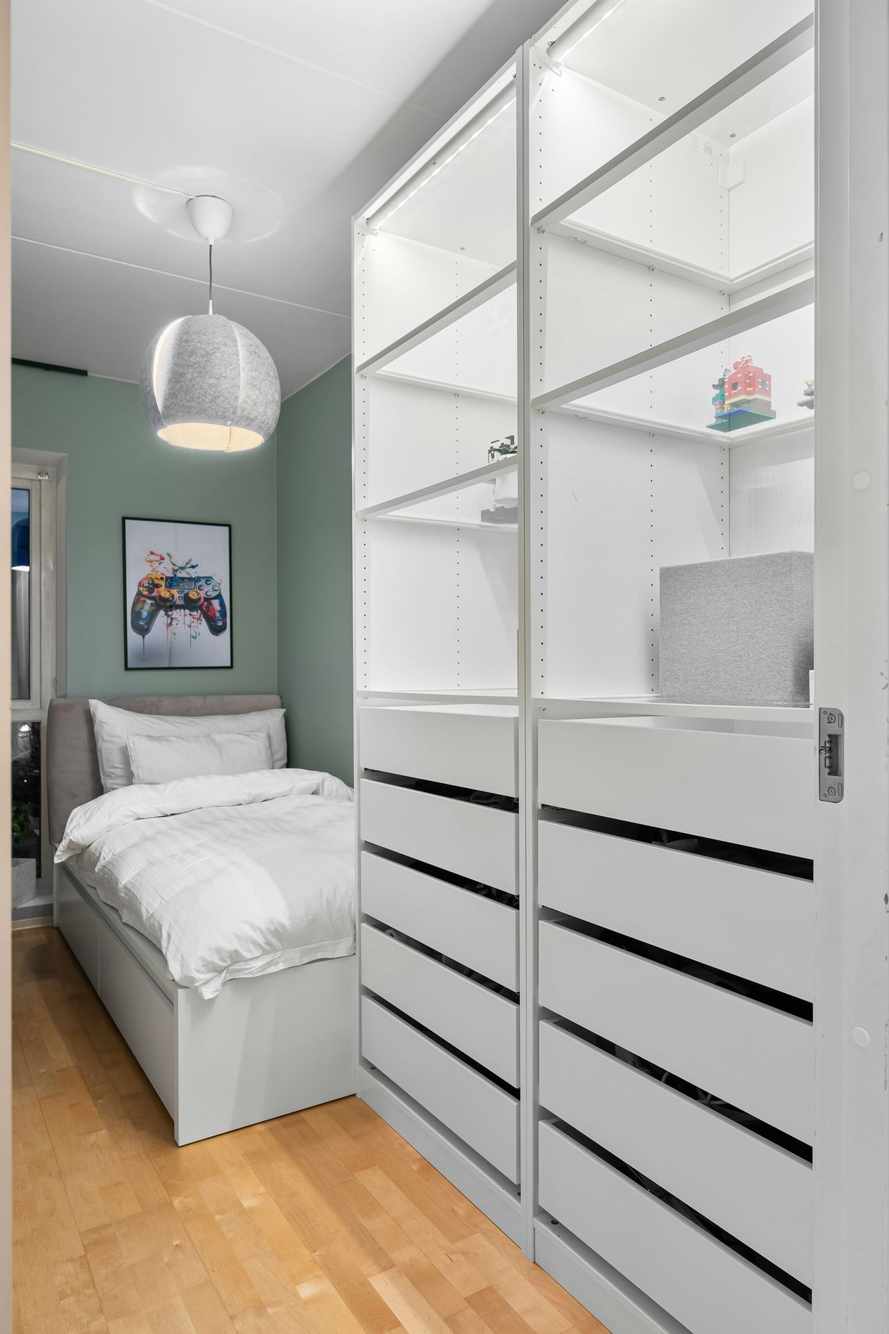 A bedroom with a bed and a closet